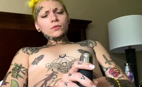 tattooed-webcam-milf-pleasing-herself-with-her-new-sex-toy