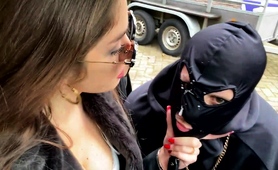 gorgeous-milf-mistress-humiliating-a-masked-slave-outdoors